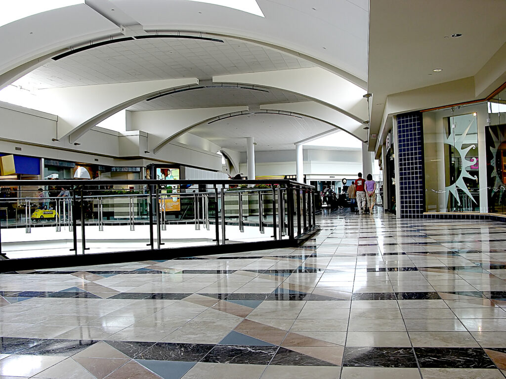 interior second floor of the shopping mall with clean and strip flooring.